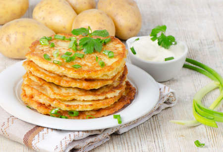 Potato Pancake on a wooden tableの写真素材
