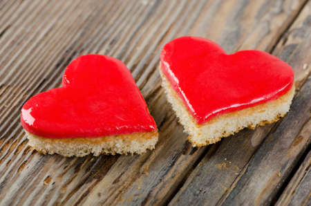 Two  valentine cakes on a wooden tableの写真素材