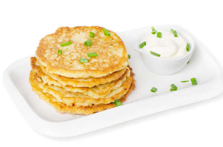 Potato Pancake with Sour Cream isolated on whiteの写真素材