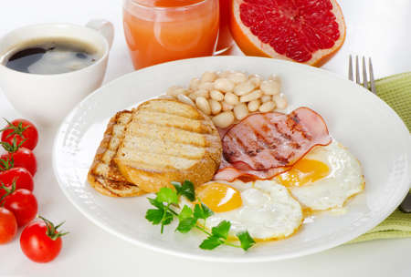 Traditional breakfast with bacon and fried eggsの写真素材