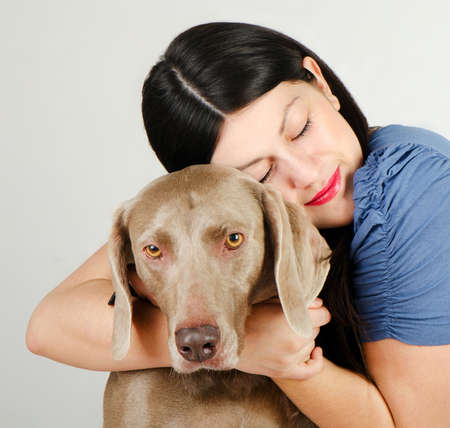 Young beautiful women with dogの写真素材
