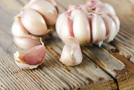 Garlic  on a wooden table. Selective focusの写真素材