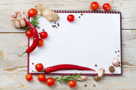 Empty notebook  ready for recipes or menu on a wooden tableの写真素材