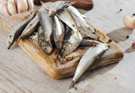Salted fish on a wooden tableの写真素材