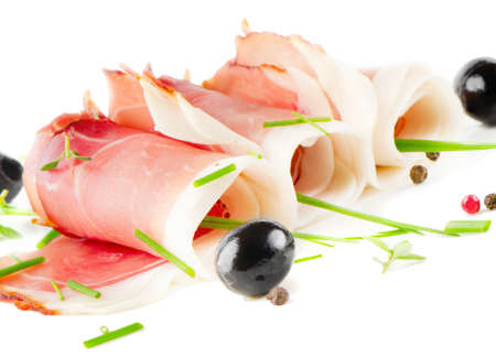 Slices of bacon and herbs isolated on whiteの写真素材