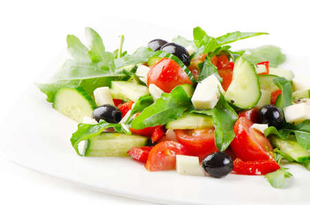 greek salad isolated on whiteの写真素材