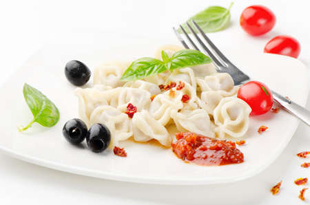Ravioli  with tomato sauce and basilの写真素材