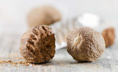 Nutmegs on a wooden table. Selective focus.の写真素材