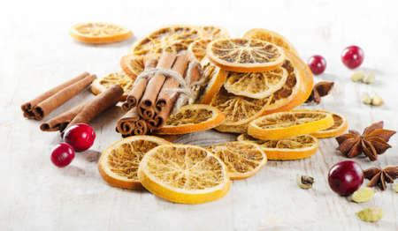 spices and dried oranges on  wooden tableの写真素材