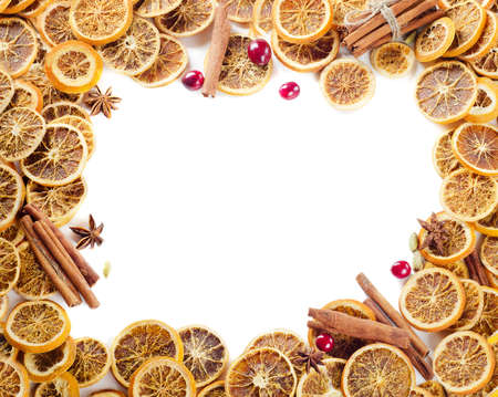 spices and dried oranges isolated on white の写真素材