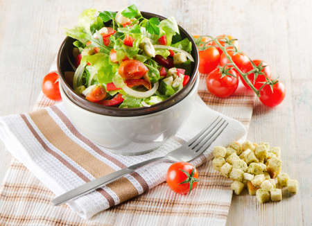 Fresh salad on a wooden tableの写真素材