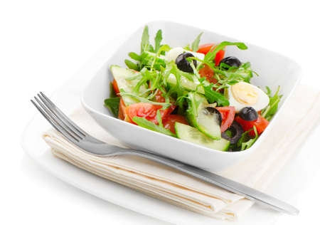 Fresh salad with black olives isolated on whiteの写真素材