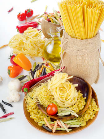 Italian food - pasta , olive oil     and   fresh vegetablesの写真素材