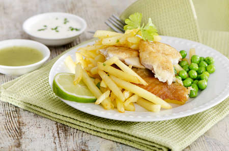 British food - fish and chips on a wooden tableの写真素材