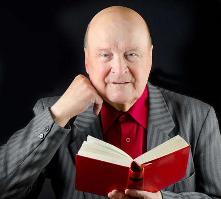 Senior man reading book