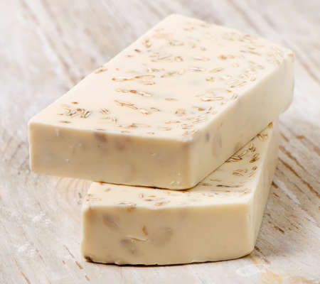 Homemade Soap with oat meal on a wooden tableの写真素材