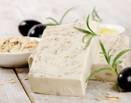 Homemade Soap with oat meal and olives  on a wooden table. Selective focusの写真素材