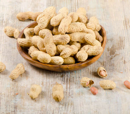 Peanuts on a wooden tableの写真素材
