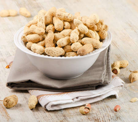 Peanuts on a wooden tableの写真素材