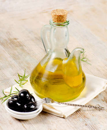 Olive oil and black olivesの写真素材