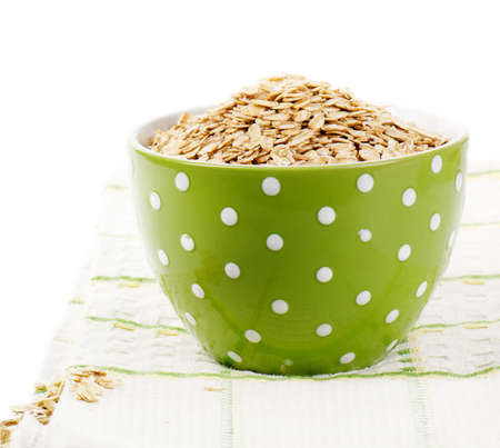 Oat flakes isolated on white backgroundの写真素材