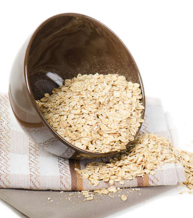 Oat flakes isolated on white backgroundの写真素材