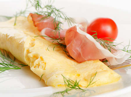 A  healthy breakfast.Omelette with cherry tomatoes and herbs.の写真素材