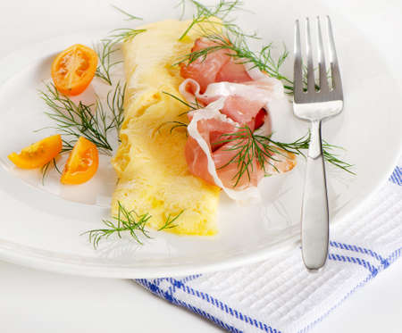 A healthy breakfast.Omelette with cherry tomatoes and bacon. Selective focusの写真素材
