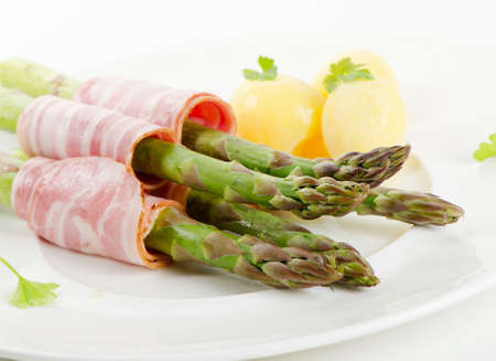 asparagus served with ham Selective focusの写真素材