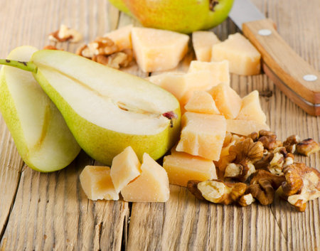 Cheese and pears on a wooden table  Selective focusの写真素材