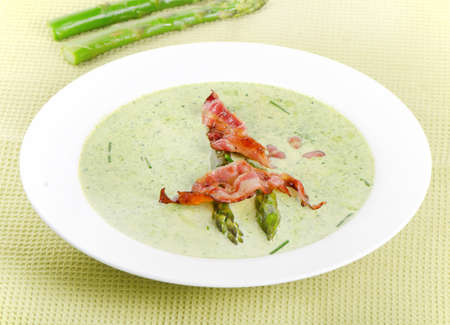 Creamy soup with asparagusand bacon . Selective focusの写真素材
