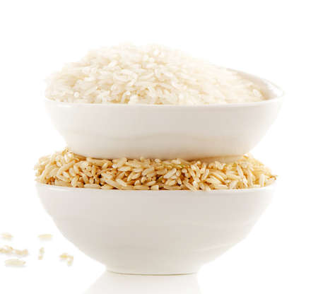 White and brown rice isolated on white. Selective focusの写真素材