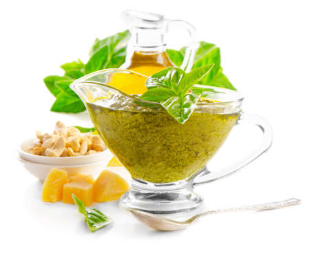 Italian food - pesto and ingredients isolated on white. Selective focusの写真素材