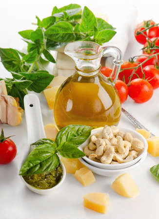 Italian food - pesto and ingredients isolated on white. Selective focusの写真素材