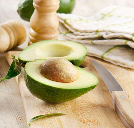Avocado on a wooden table Selective focusの写真素材