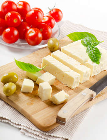 Feta cheese with green olives and herbsの写真素材