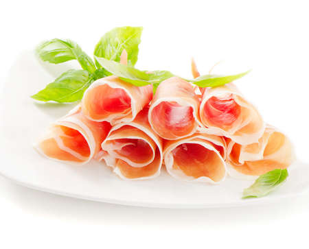 Slices of cured ham isolated on a white backgroundの写真素材