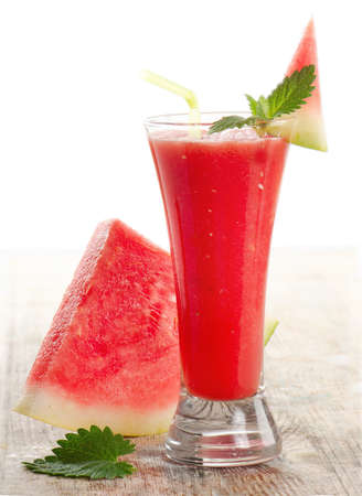 Glass of watermelon smoothie isolated on whiteの写真素材