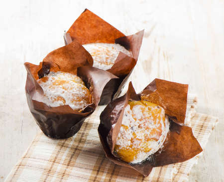 Homemade Muffins on a wooden tableの写真素材