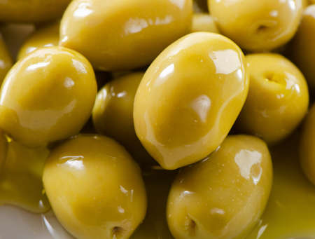 Green olivesの写真素材