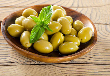 Green olives isolated on whiteの写真素材