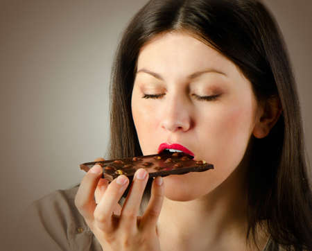 Young woman with with a chocolate barの写真素材