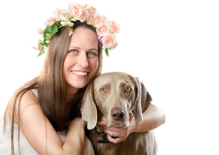 Beautiful smiling woman with dog isolated on white backgroundの写真素材