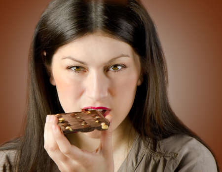 Young woman with with a chocolate barの写真素材