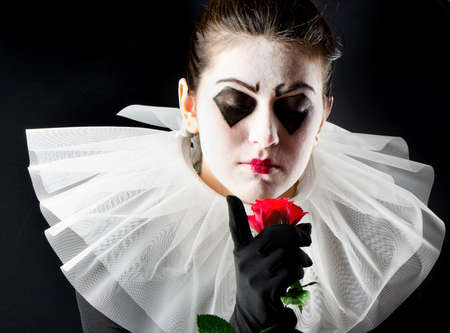 woman mime with red roseの写真素材