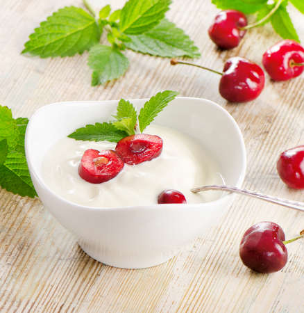 Yogurt with berries on a wooden table. Selective focusの写真素材