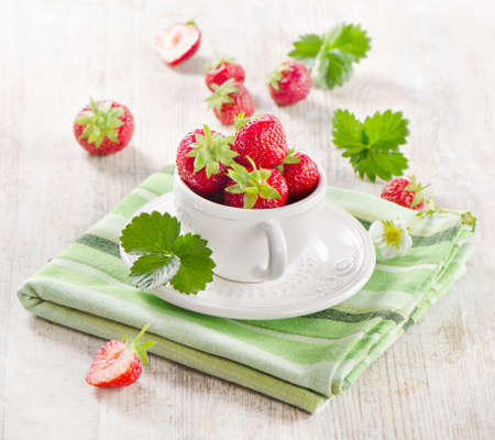 Fresh strawberries on a wooden table .Selective focusの写真素材