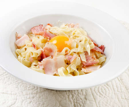 Pasta Carbonara on a white plateの写真素材