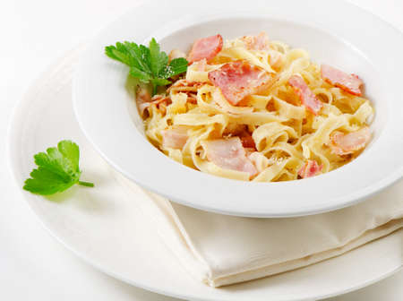 Pasta Carbonara on a white plateの写真素材