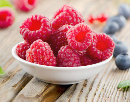 Raspberry on wooden table